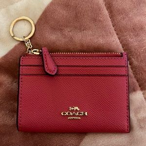 small pink Coach ID wallet coin purse